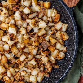 overhead view of fried potatoes in a skillet