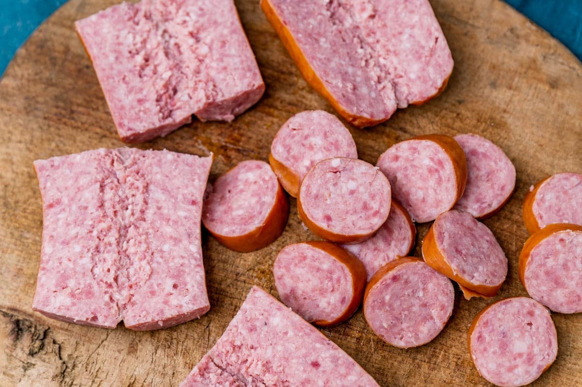 uncooked kielbasa on a cutting board