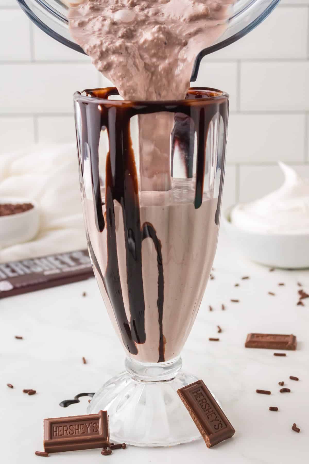milkshake with ice cream pouring into a cup