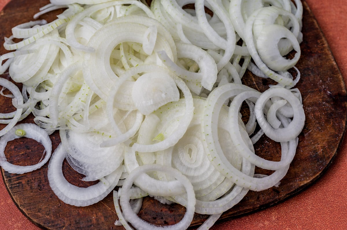 sliced onions on a cutting board