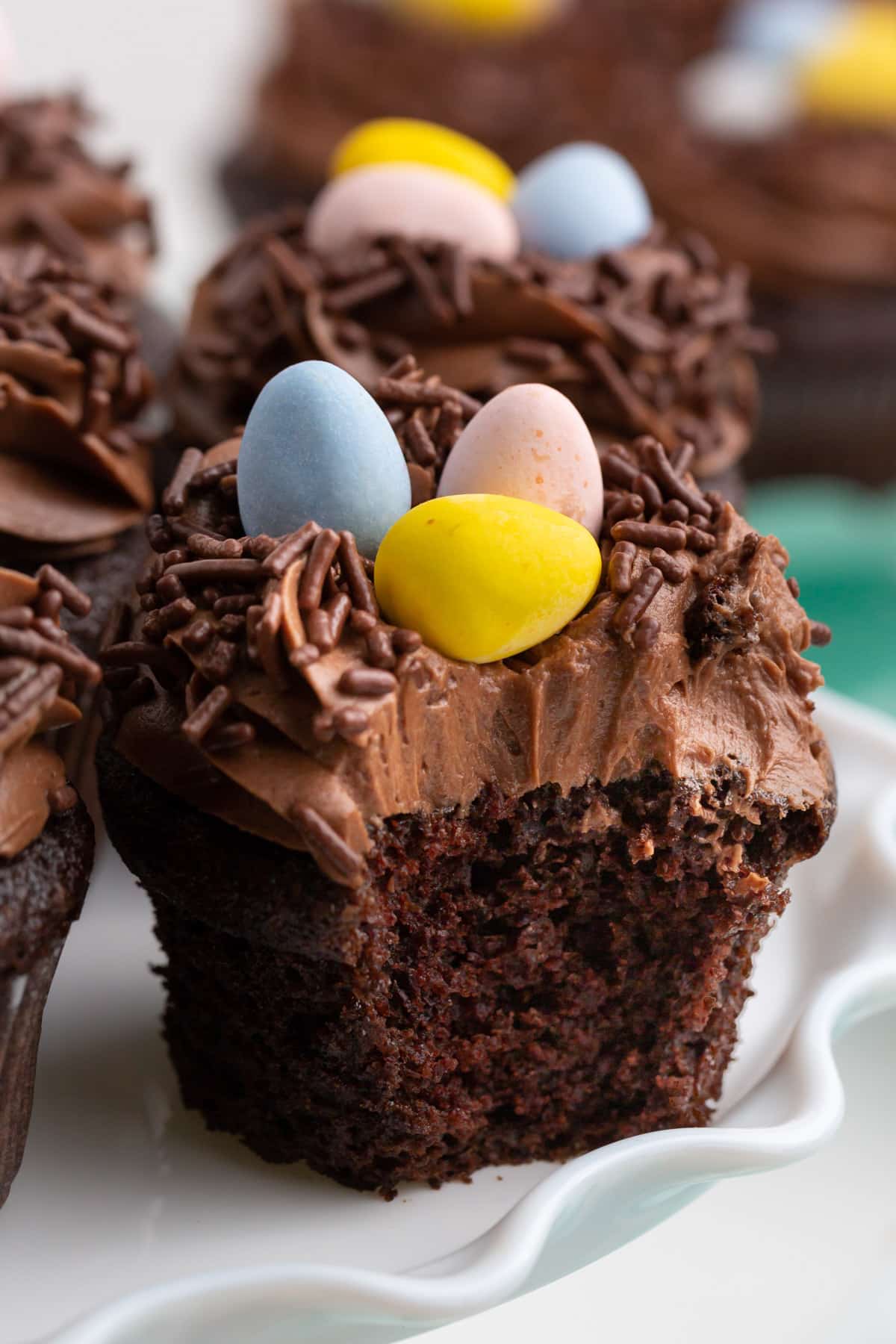 a chocolate easter cupcake with a bite taken out