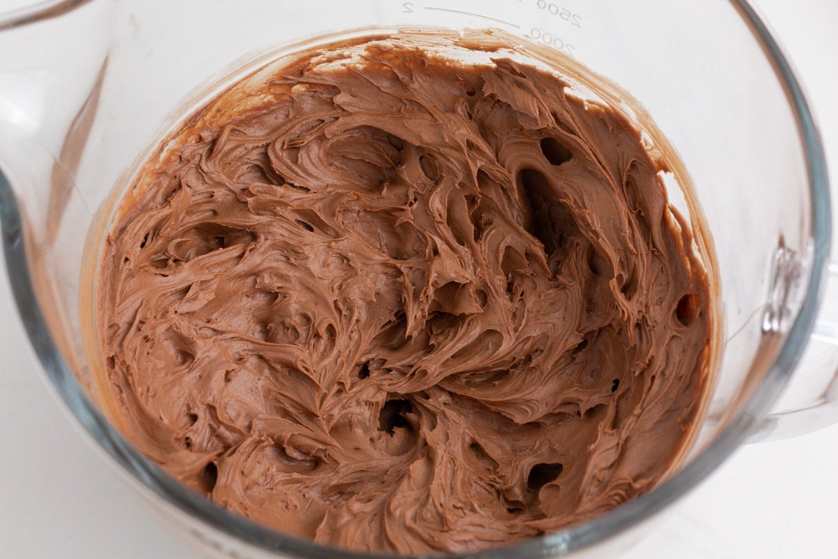 chocolate frosting in a glass bowl