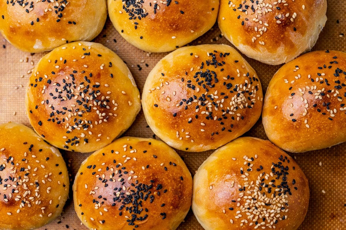 sourdough buns on a baking sheet