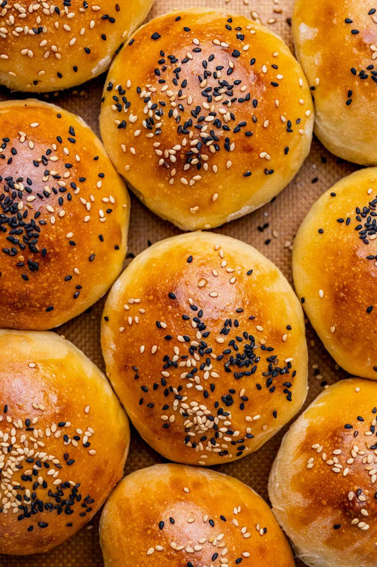 sourdough buns on a baking sheet