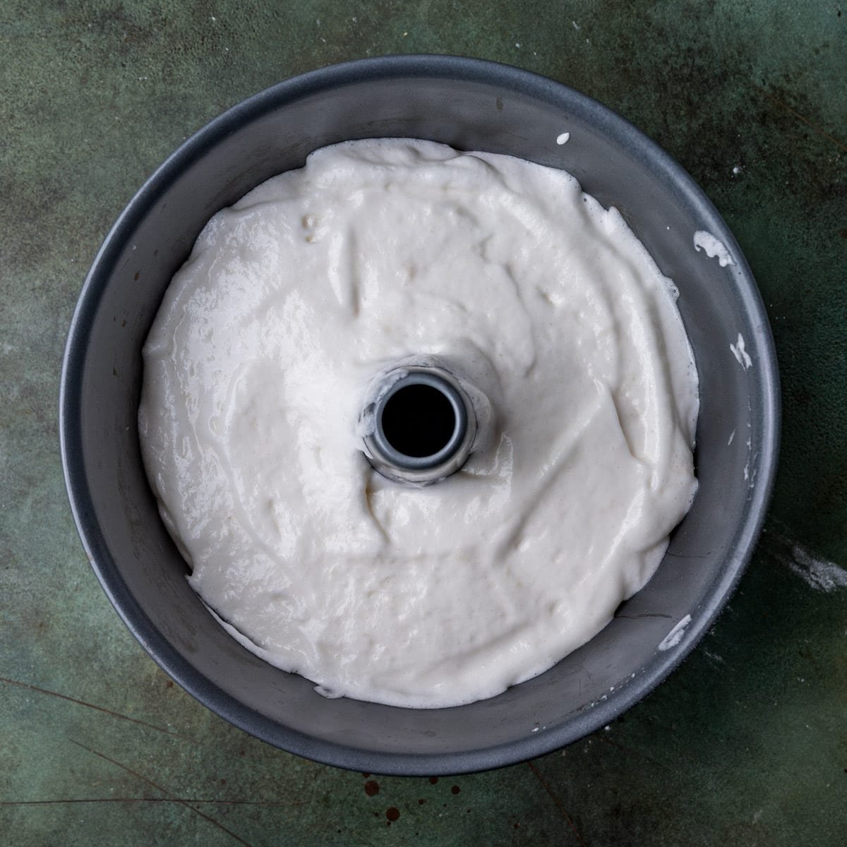 angel food cake batter in a tube pan