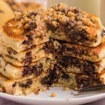 a plate of chocolate chip pancakes with peanut butter streusel