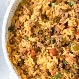 overhead view of spanish rice with ground beef in a skillet