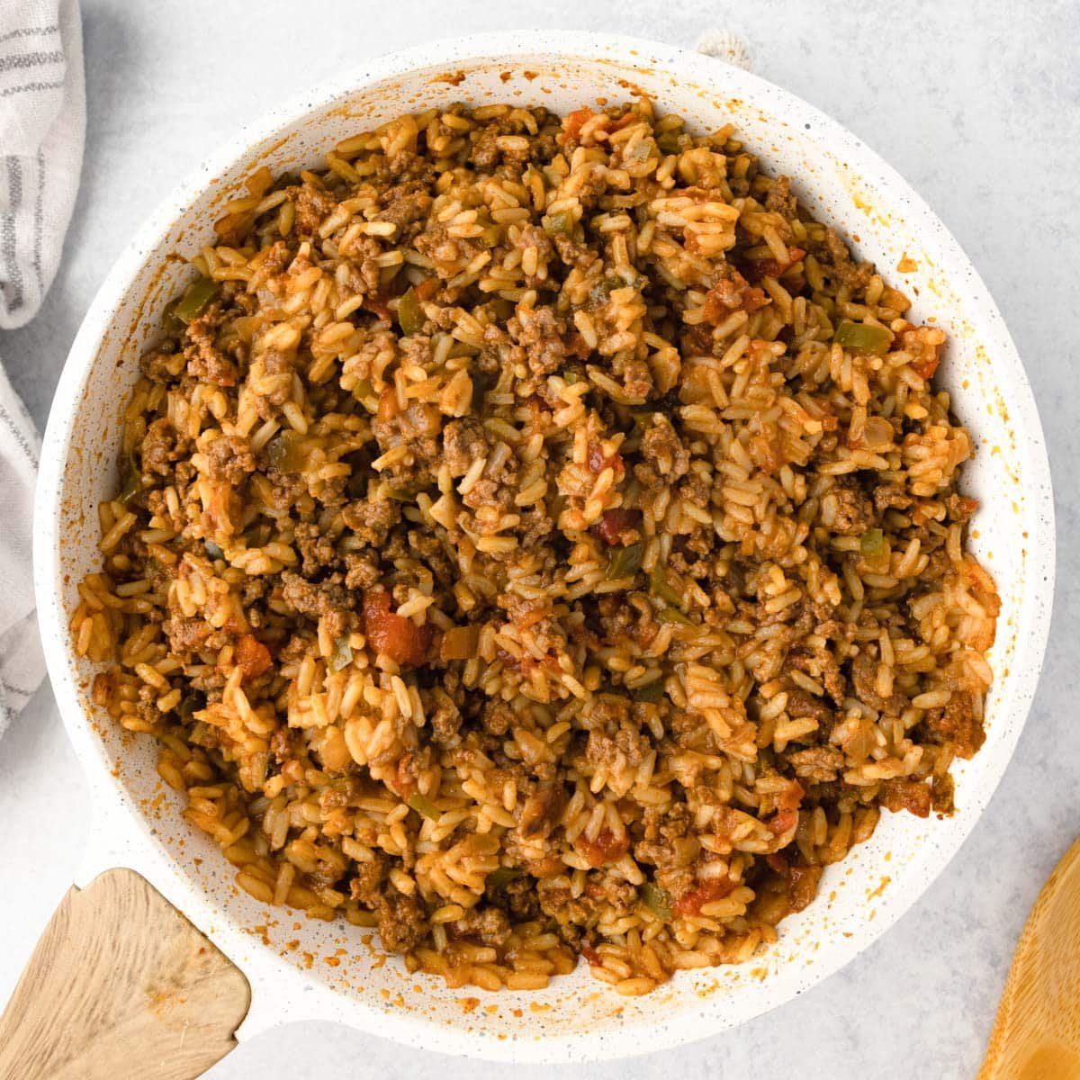spanish rice in a skillet on a table