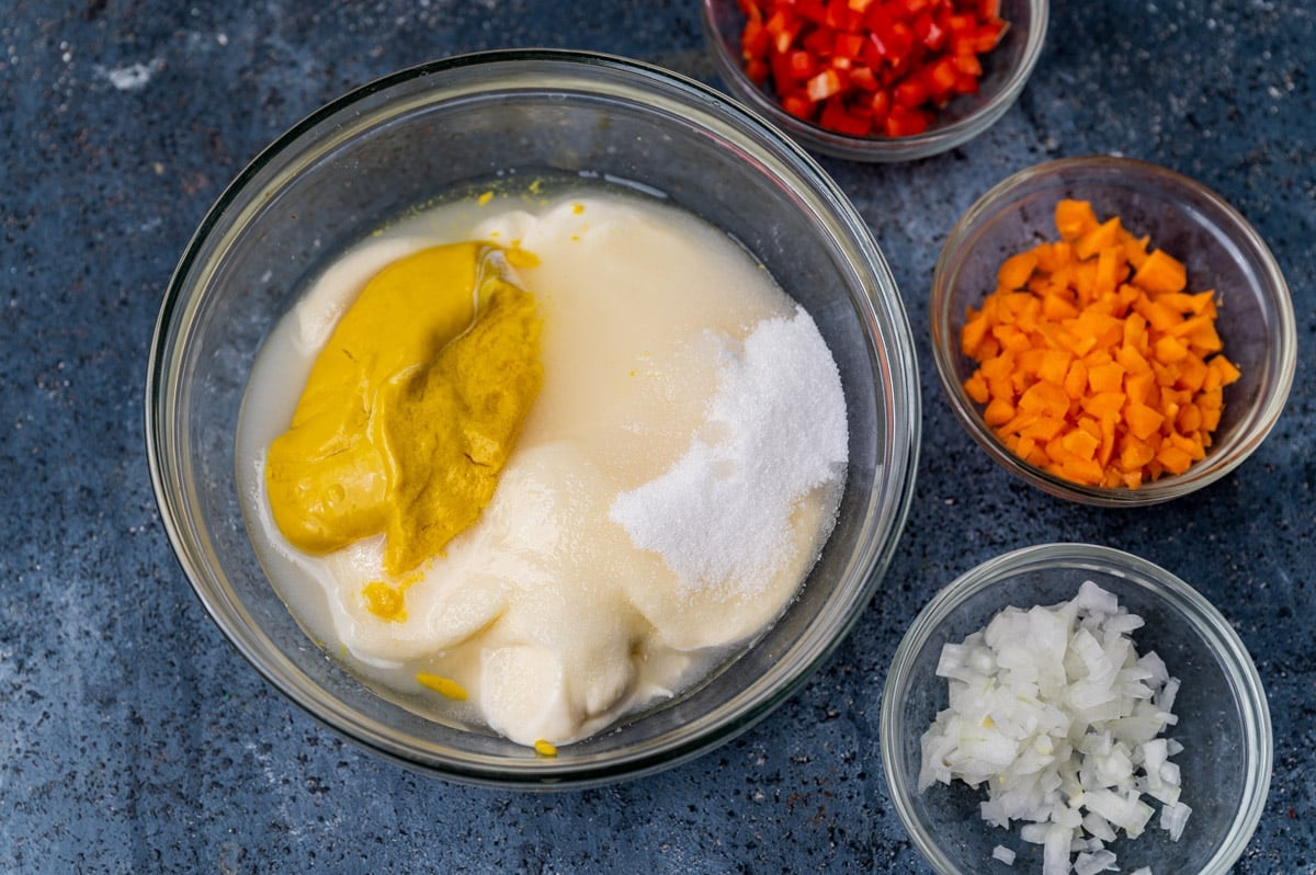 mayo, sugar, mustard and vinegar in a glass bowl