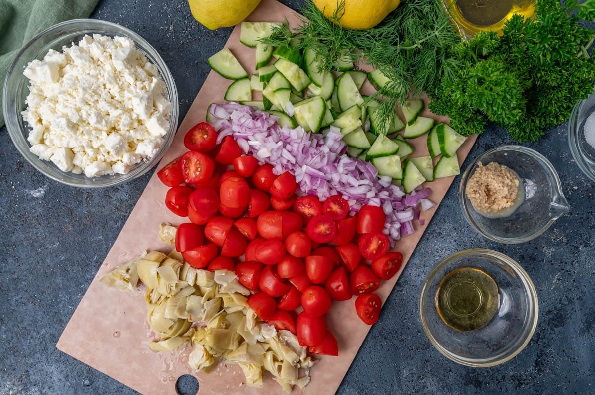 chopped veggies and herbs on a table