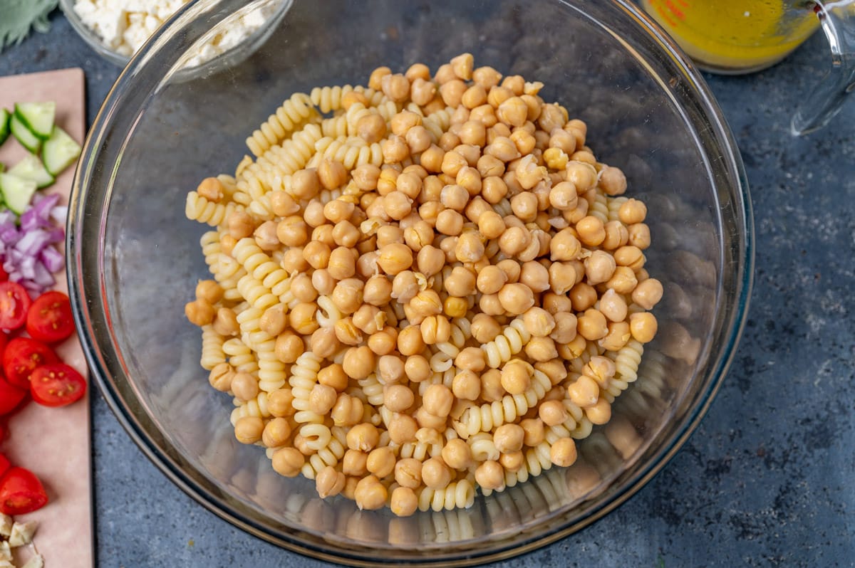 pasta and chickpeas in a glass bowl