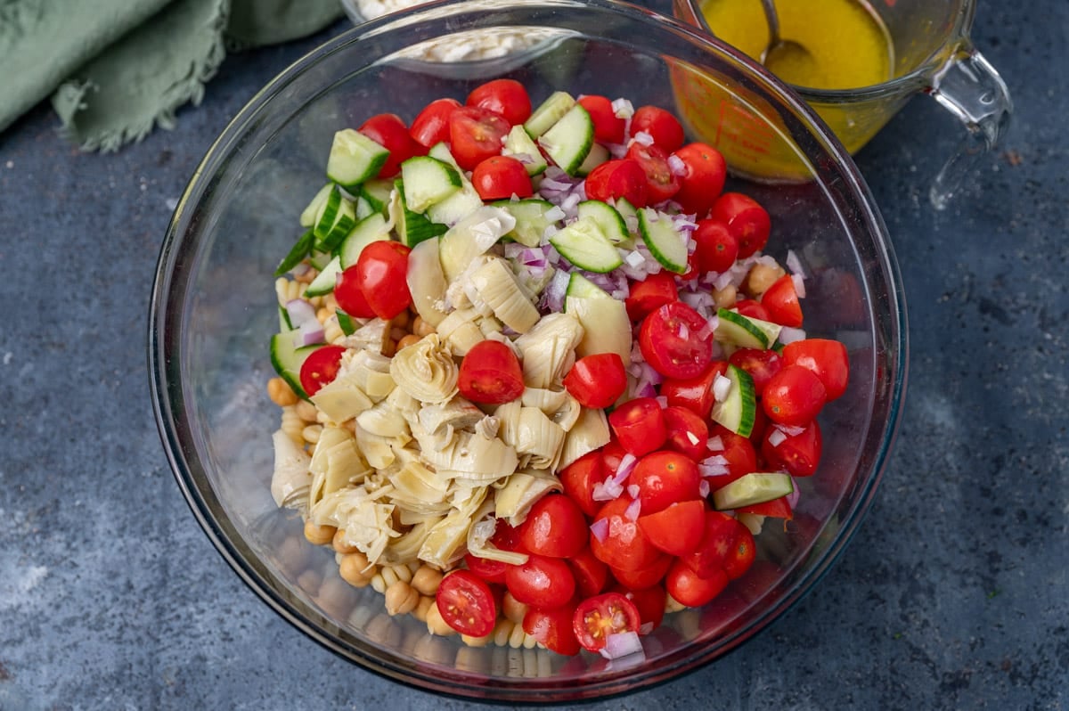 ingredients for chickpea pasta salad in a bowl