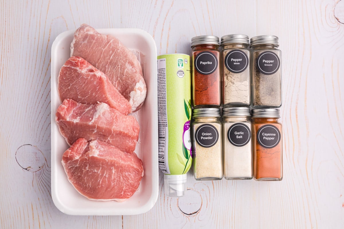 ingredients for grilled pork chops on a table