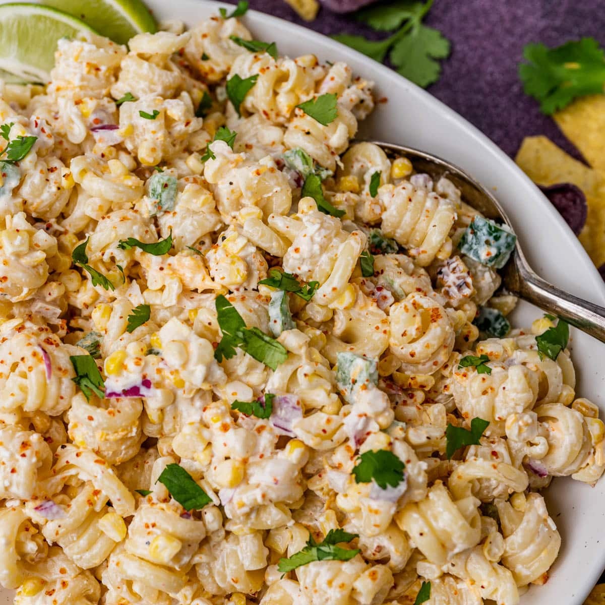 mexican street corn pasta salad on a plate with a spoon