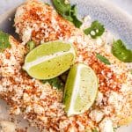 clsoeup of mexican street corn on a plate