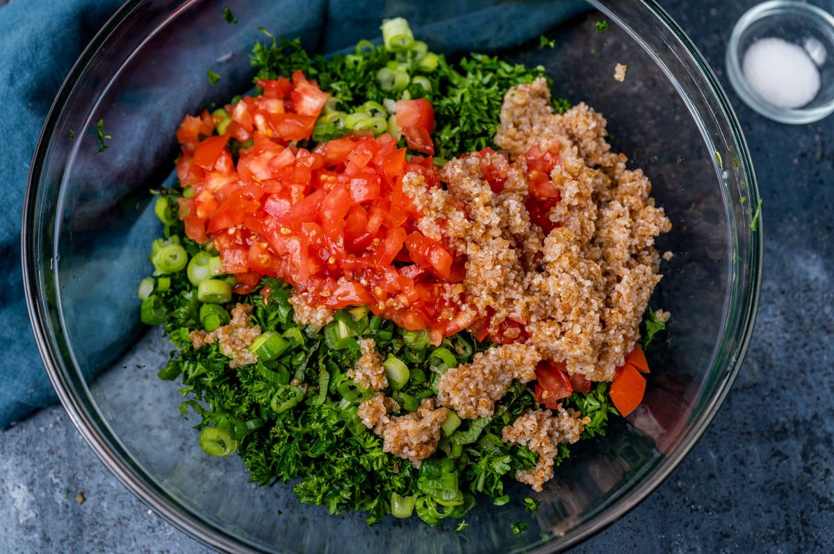 parsley, onion, tomato and bulgur in a bowl