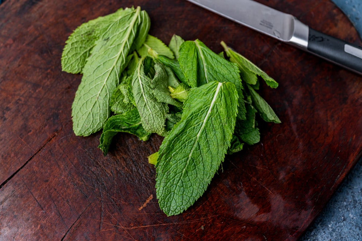fresh mint leaves on a cutting board