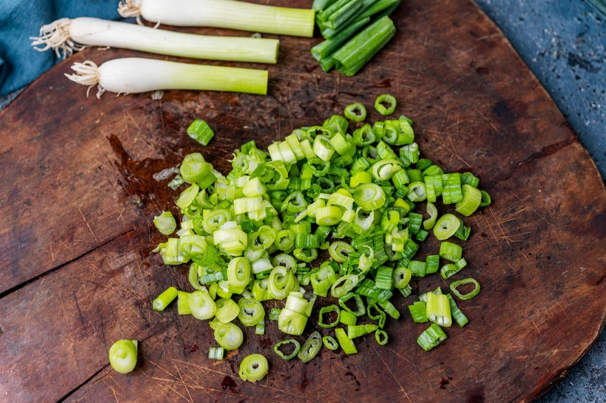 diced green onions on a cutting board