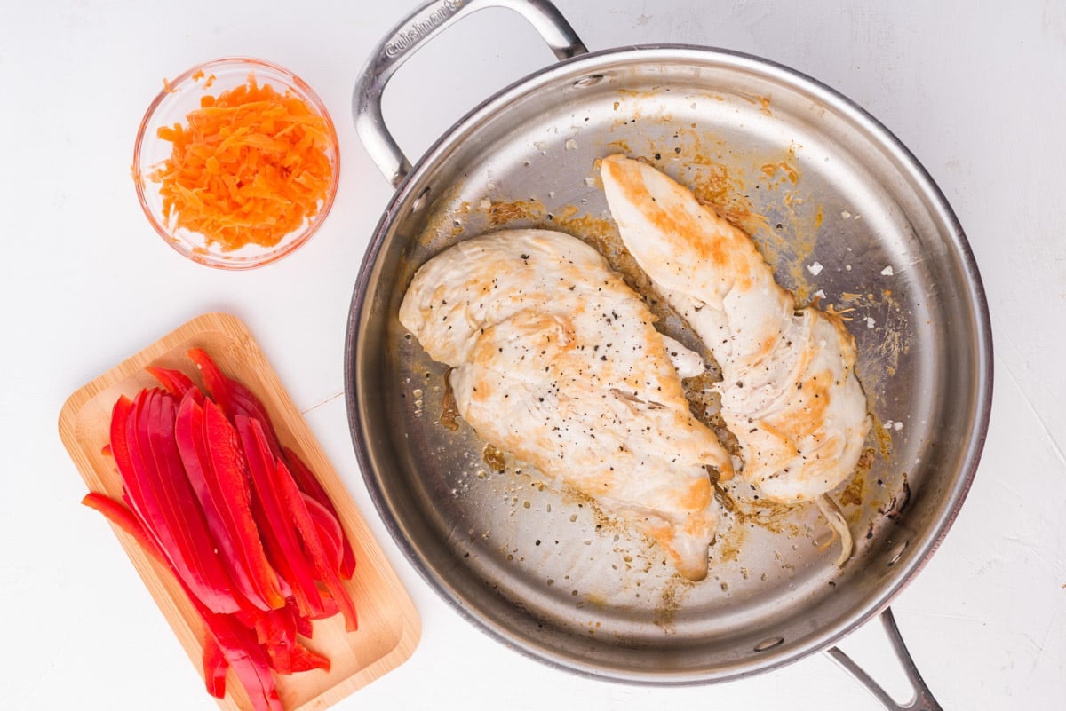 lightly browned chicken in a skillet