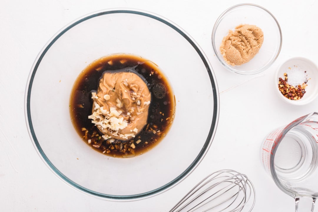 ingredients for peanut sauce in a mixing bowl