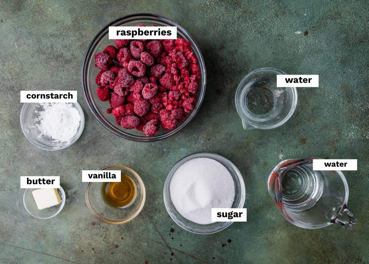 ingredients for raspberry sauce on a table