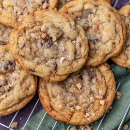 a pile of toffee cookies on a wire rack