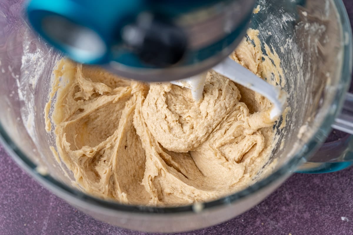 cookie dough in a stand mixer mixing bowl