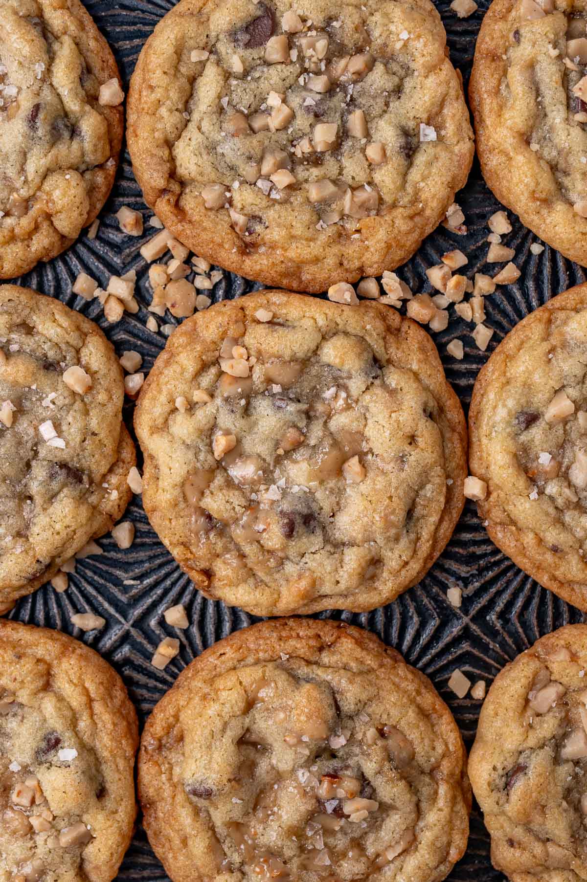 overhead view of toffee cookies sitting on a baking sheet