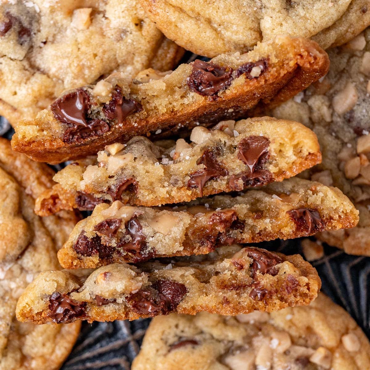 a stack of toffee cookies, broken in half to show the melted chocolate