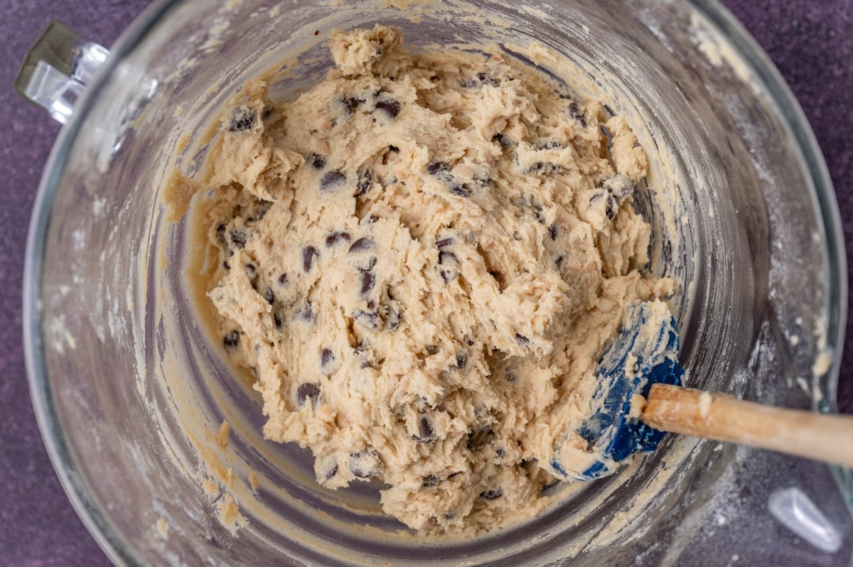 cookie dough in a glass bowl with a spatula