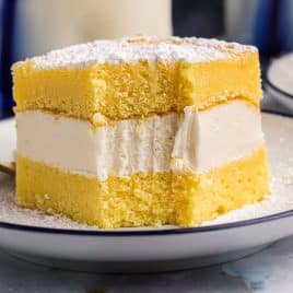 closeup of a slice of twinkie cake on a plate with a bite out