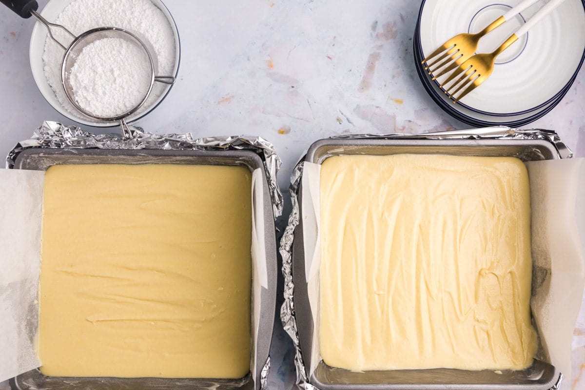 cake batter in two square pans