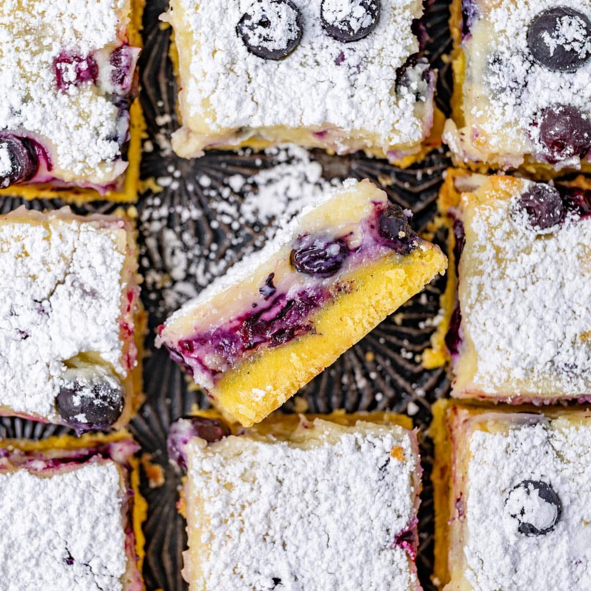 overhead view of blueberry lemon bars with powdered sugar on top