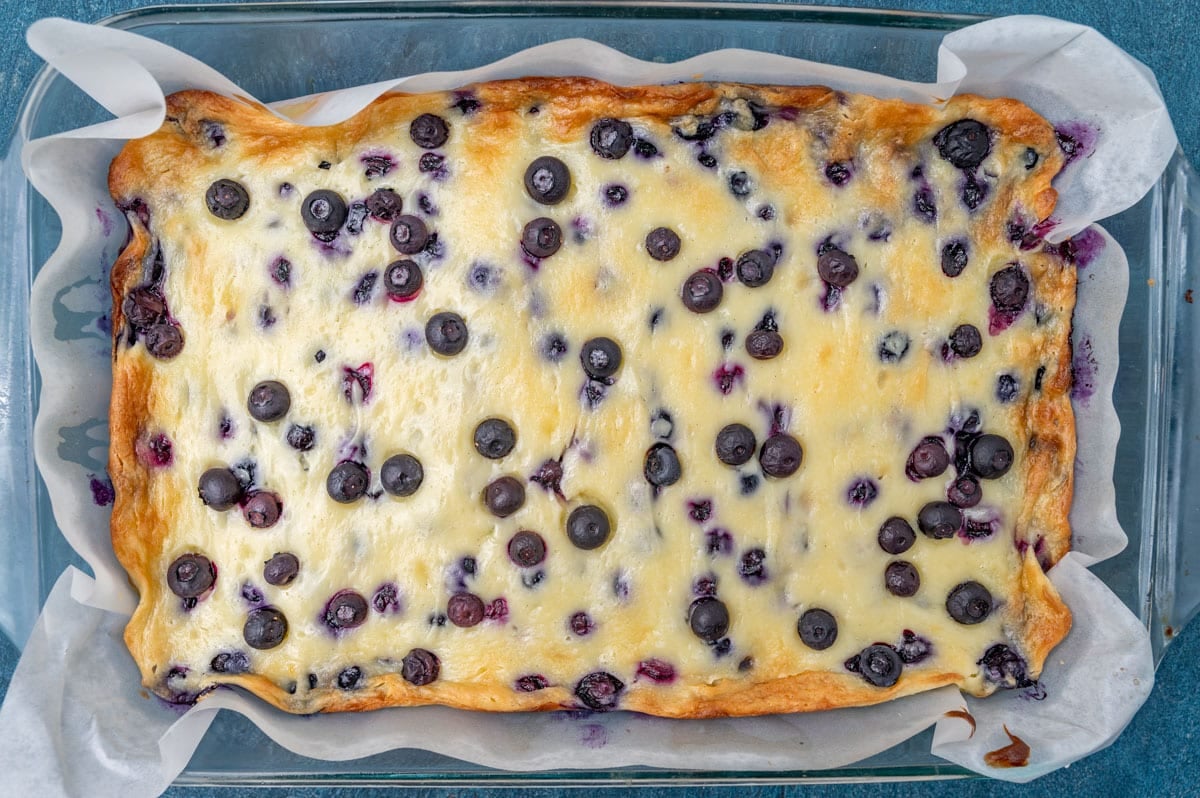 lemon blueberry gooey butter cake in a 9x13 cake pan