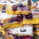 a plate of blueberry lemon gooey butter cake on a table