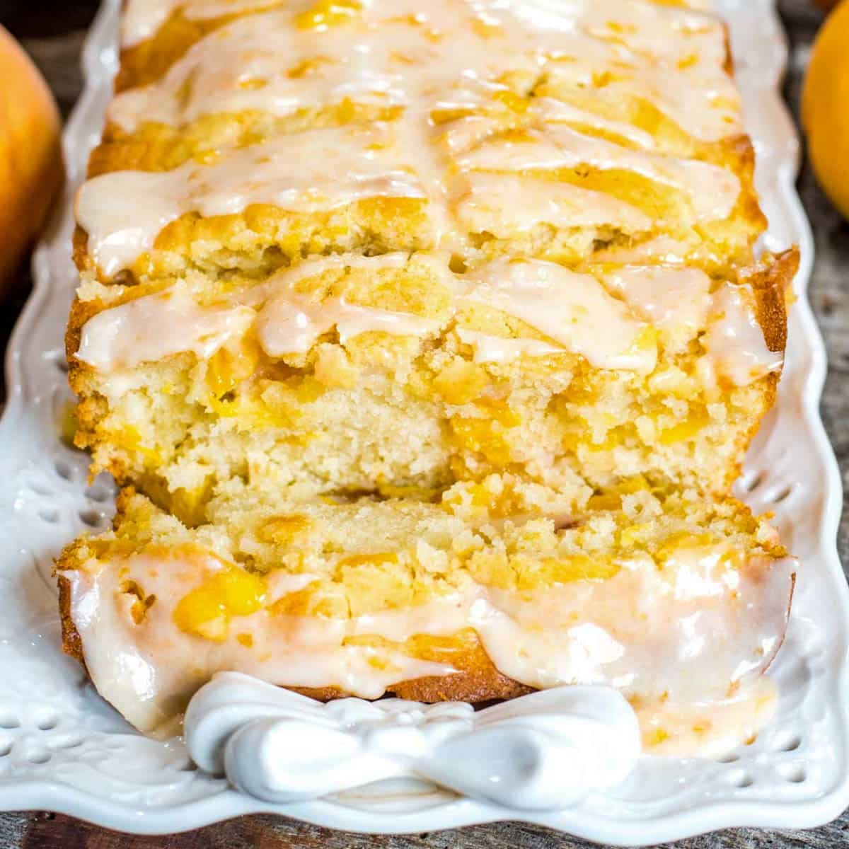 a sliced loaf of glazed peach bread