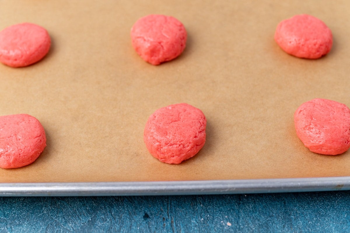 unbaked strawberry cookies on a baking sheet