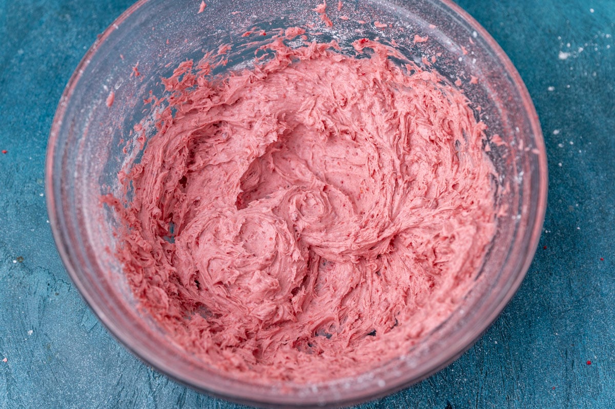 strawberry frosting in a glass bowl