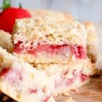 strawberry crumb bars sitting on a table