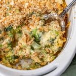 cheesy creamy broccoli casserole in a baking dish