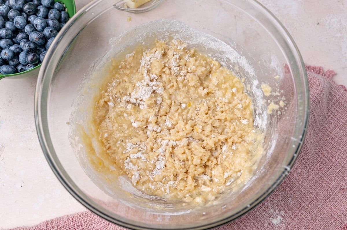 half mixed quick bread batter in a glass bowl