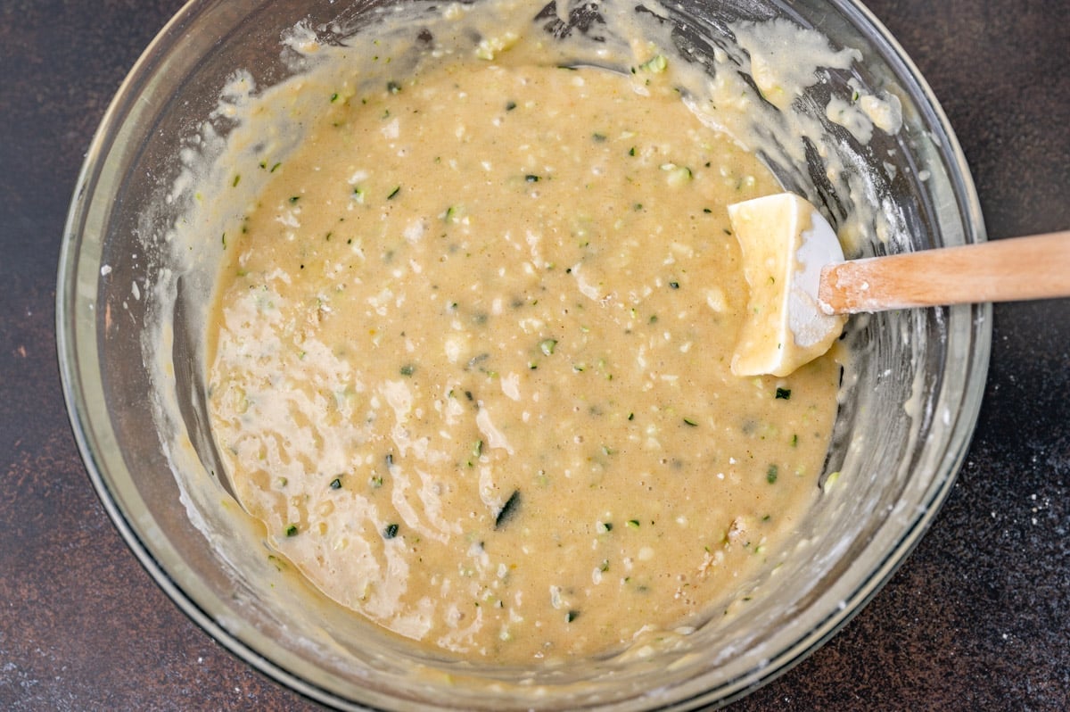 zucchini bread batter in a glass bowl