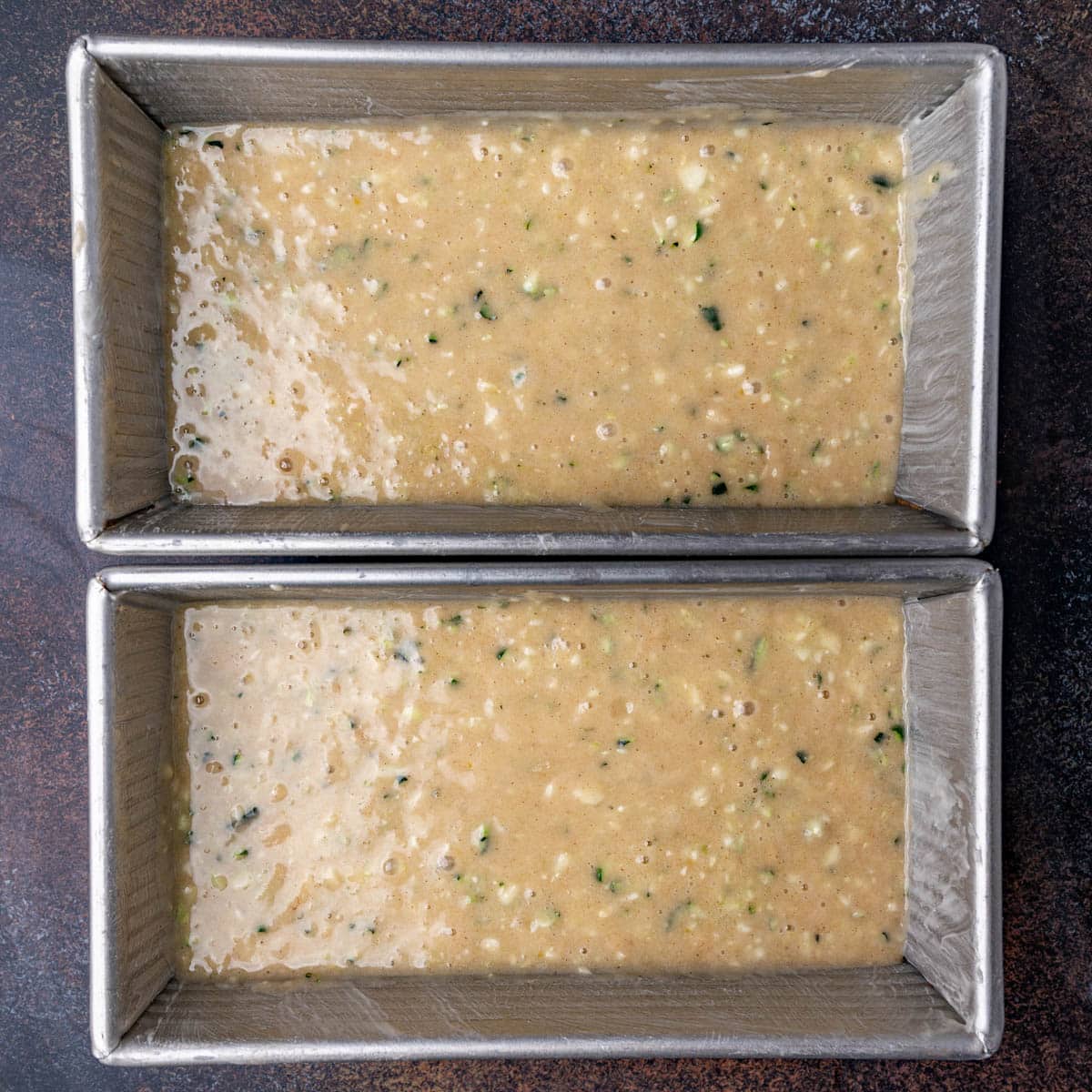 zucchini bread batter in loaf pans