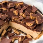 chocolate peanut butter pie in a pie plate with a piece missing