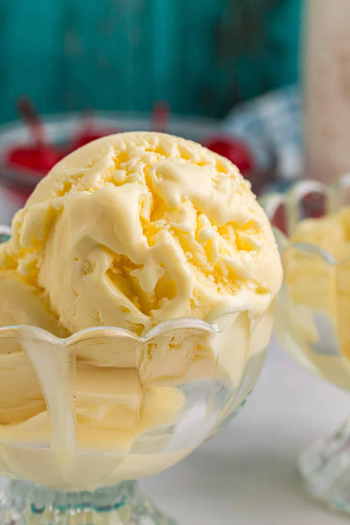 scoops of vanilla frozen custard in a glass bowl