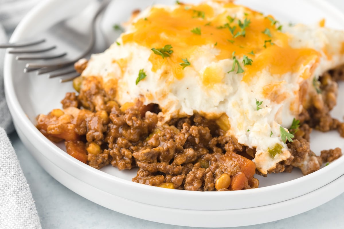 a plate of cottage pie with a fork