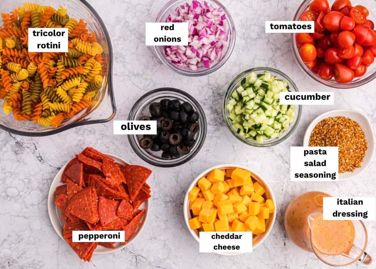 ingredients for Italian pasta salad on a table