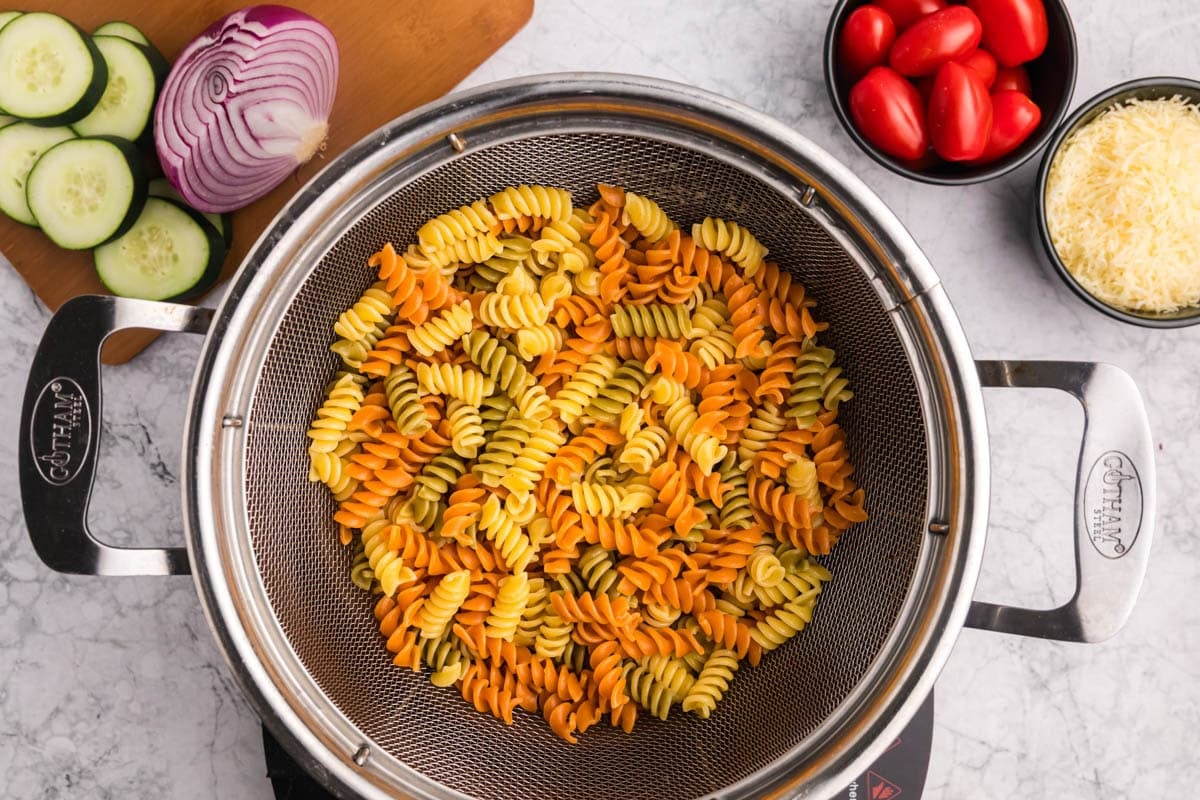 tricolor rotini pasta in a colander