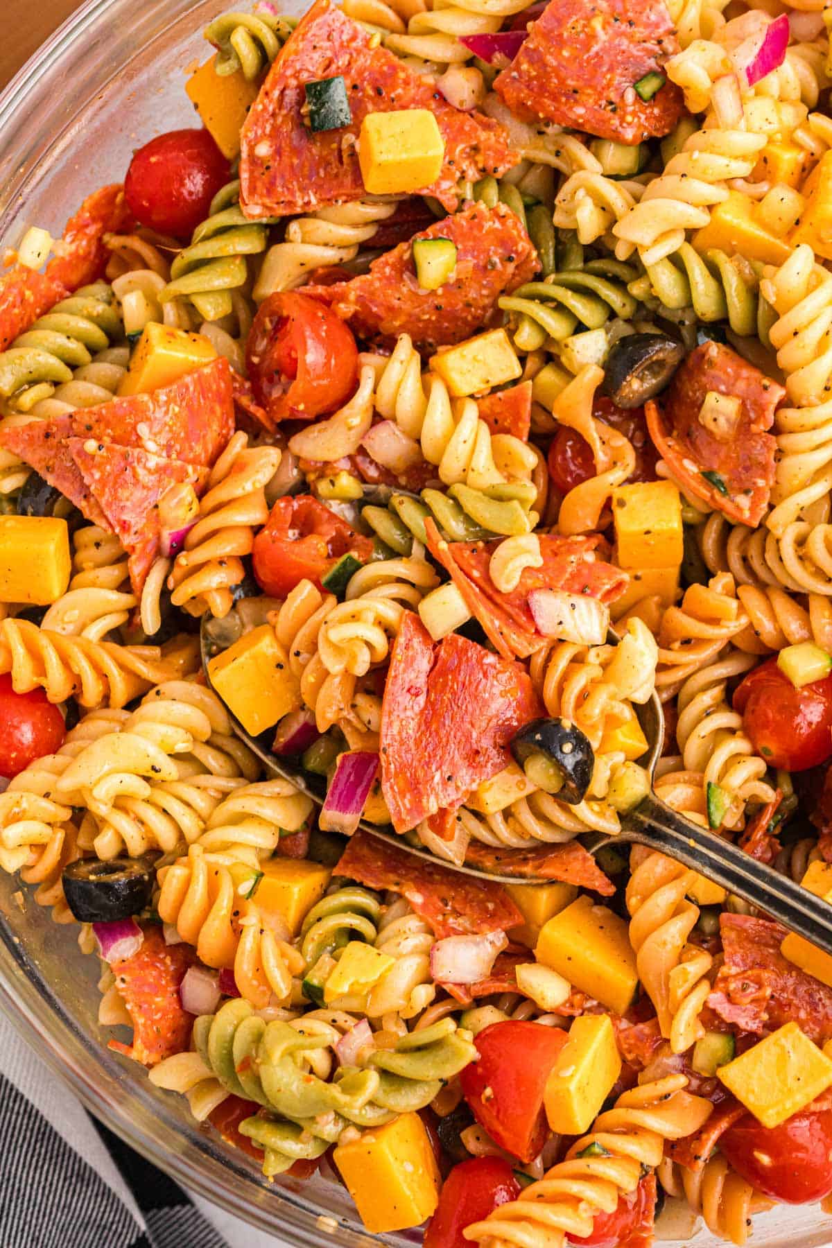 overhead view of italian pasta salad with a spoon