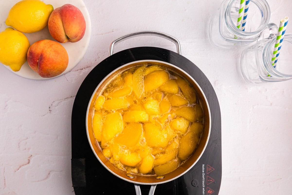 peaches and water in a saucepan